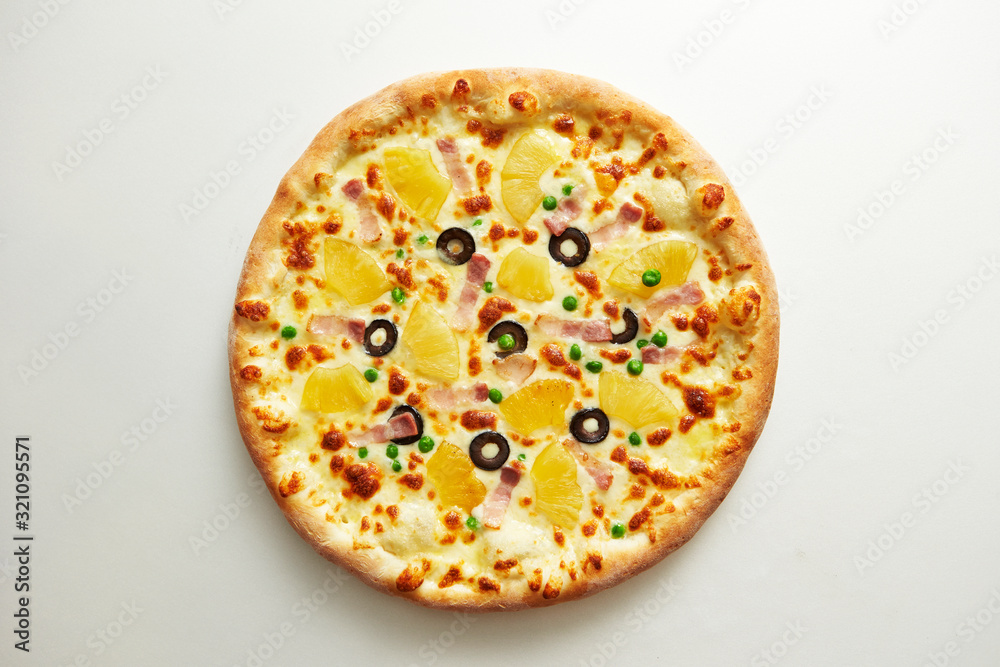 Pineapple and olive pizza on white background Pineapple and olive pizza on white background