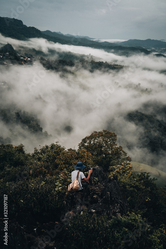 man on top of mountain