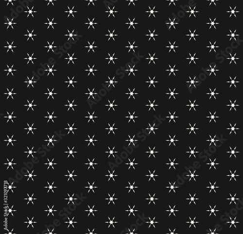 Vector snowflakes seamless pattern. Abstract minimalist black and white texture with tiny geometric floral shapes, snow flakes. Simple winter holiday background. Stylish repeatable decorative design