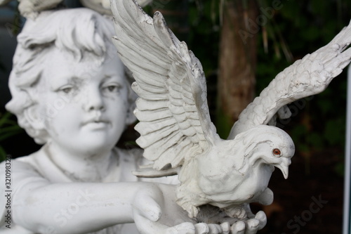 Child Statue Releasing Dove