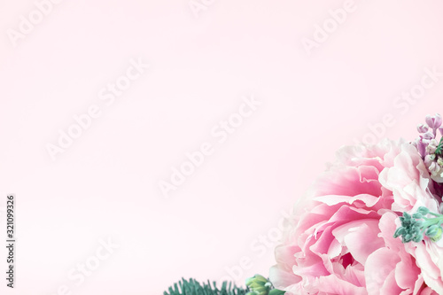 Very beautiful bouquet of flowers from peonies decorated with coniferous branches, winter-spring plants close-up. Holiday concept. Flowers for Mother's Day. Copy space.