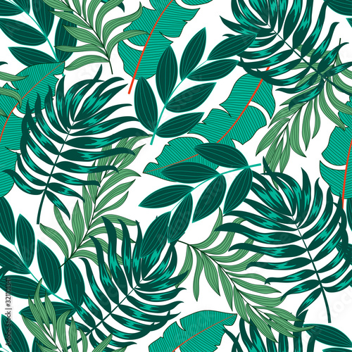 Fashionable seamless tropical pattern with bright green and blue plants and leaves on a light background. Summer colorful hawaiian seamless pattern with tropical plants. Exotic wallpaper.