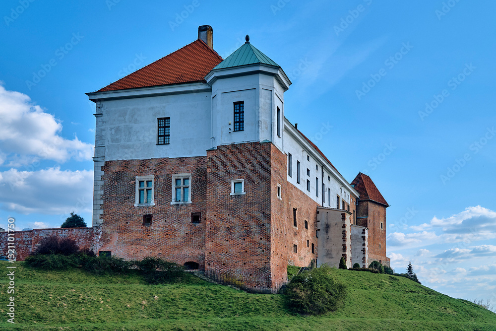 Beautiful panoramic aerial drone view to the Sandomierz Royal Castle - medieval structure in Sandomierz, Poland - was built on a slope of Vistula River by Casimir III the Great in the 16th century