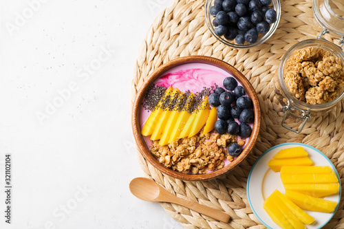 Asai bowl granola oatmeal with mango, blueberry and chia seeds photo