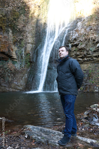 Man and waterfall