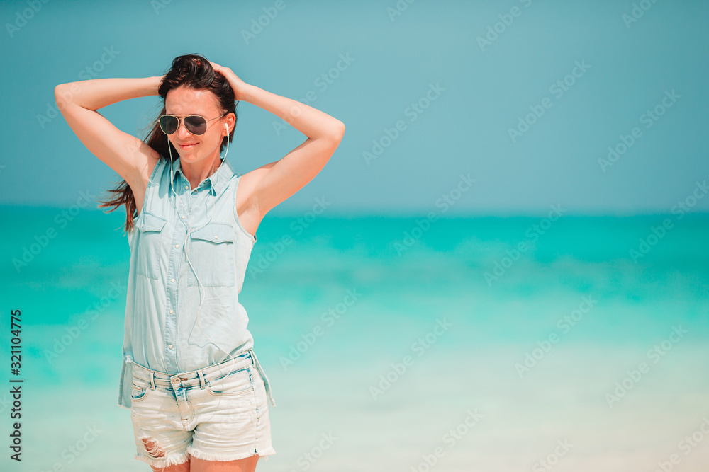 Woman laying on the beach enjoying summer holidays looking at the sea Woman laying on the beach enjoying summer holidays looking at the sea