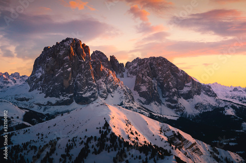 Dolomites, Italy. Sassolungo and Sassopiatto mountains during sunset in winter season.
