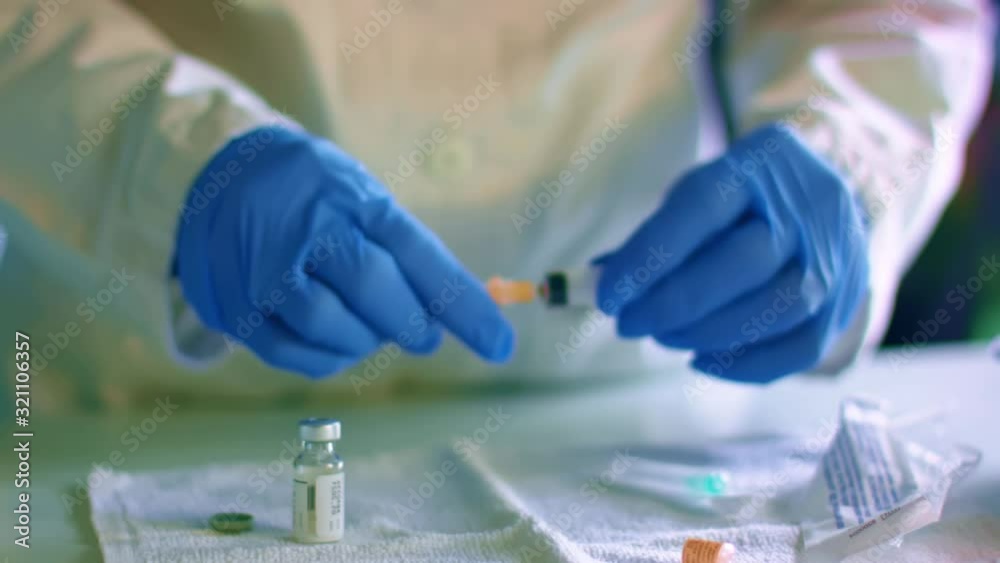 Nurse assemble needle of a syringe for injection Nurse assemble needle of a syringe for injection