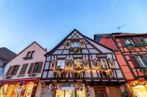 Traditional colorful house in Kaysersberg, Alsace, decorated at Christmas, France photo