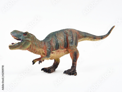 Fototapeta Naklejka Na Ścianę i Meble -  Tyrannosaur rubber toy isolated on white