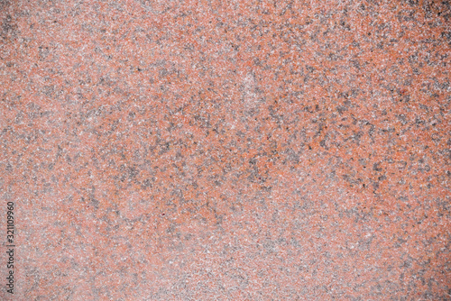 Texture of snowy red granite slab