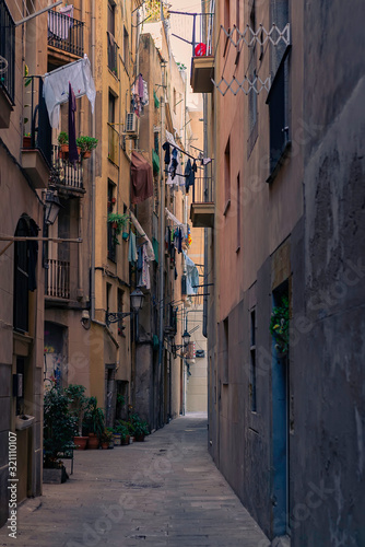 Old narrow street in Gothic Quarter. Barcelona, Spain. Spanish elegant old town urban alley.