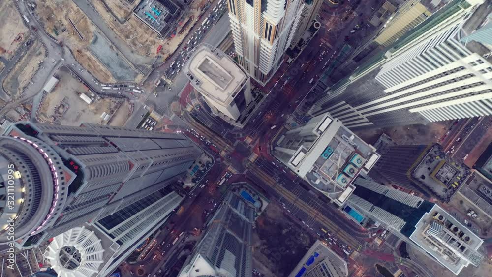 Top view of Dubai city. Aerial Drone fly over futuristic Dubai Marina district on beautiful day. Residential Modern skyscraper buildings, UAE, Middle East smart city
