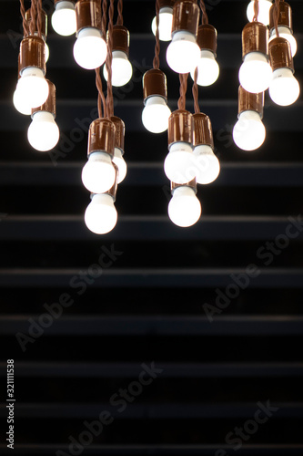 Lots of light bulbs on a dark background.