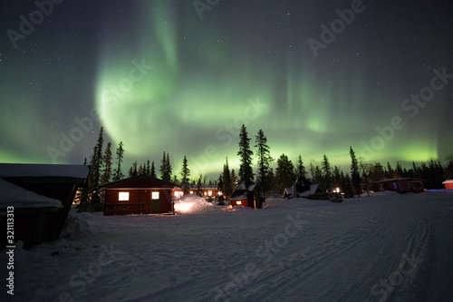 фотографія Northern Lights dancing over the sky at camp Alta, Kiruna, Lapland, Sweden