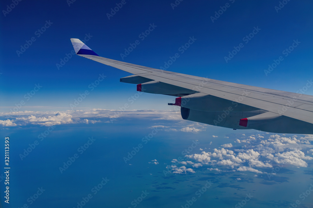 Obraz premium Sunny aerial sky landscape from and airplane window seat