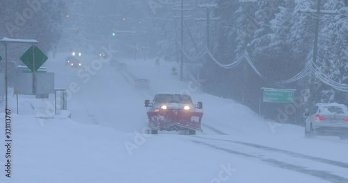 Car driving during winter snow storm in Whistler, BC,  Canada.