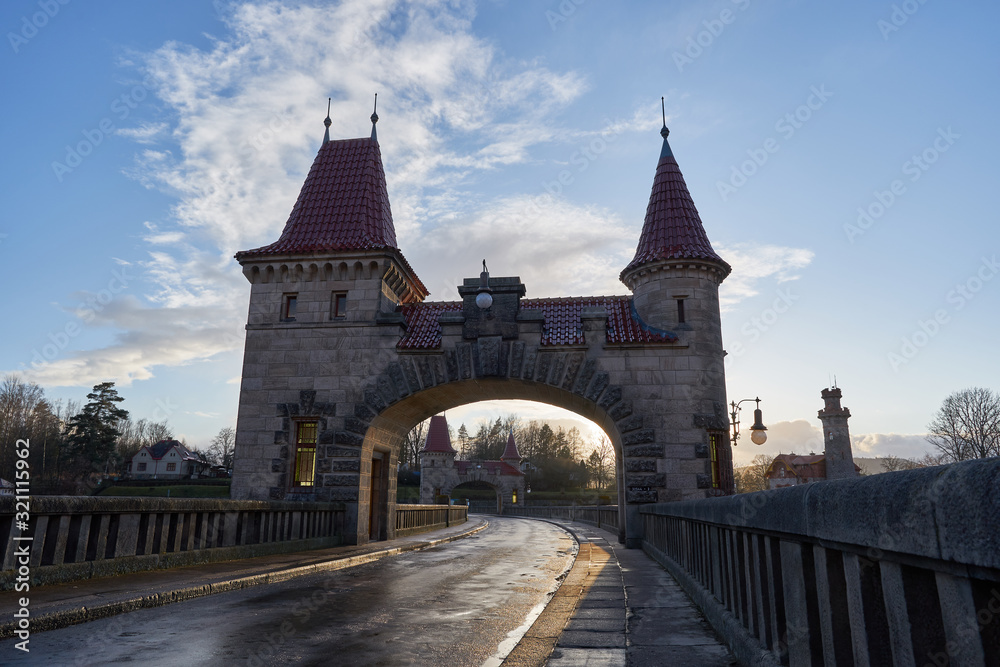 Fortified gate with two towers on the top of Beautiful historical dam Les kralovstvi in Czech Republic, build as a barrier against flooding and make electric power on biggest czech river Elbe.