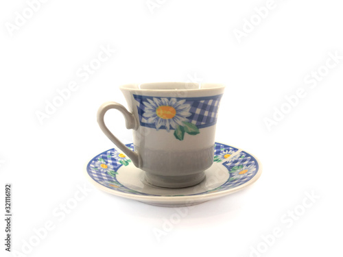 Tea cup and saucer isolated on a white background. Set of cup and saucer for tea.  Old cup with a pattern. Empty cup and saucer. 