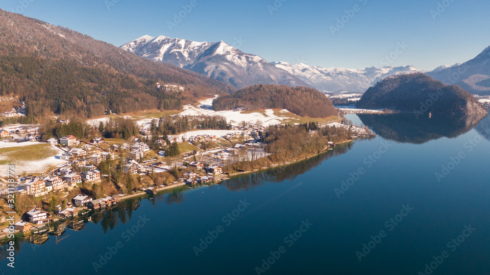 Aerial view on houses near water, small alpine village St. Wolfgang and Wolfgangsee  Lake in Austria