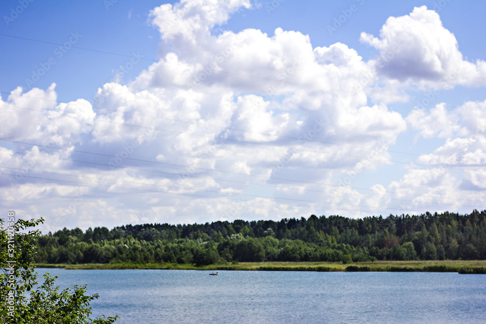 beautiful landscape - river, forest, sky in the clouds