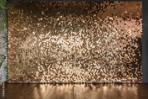 Gold sparkle glitter background. Glittering sequins wall.