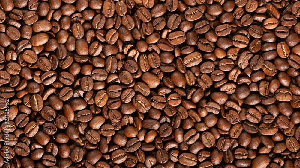 Fototapeta premium Texture of coffee seeds, selective focus, close-up