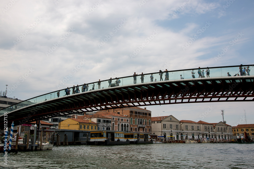 People on the glass Constitution Bridge over the Grand Canal in Venice People on the glass Constitution Bridge over the Grand Canal in Venice