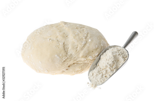 Raw dough for pastries and flour isolated on white