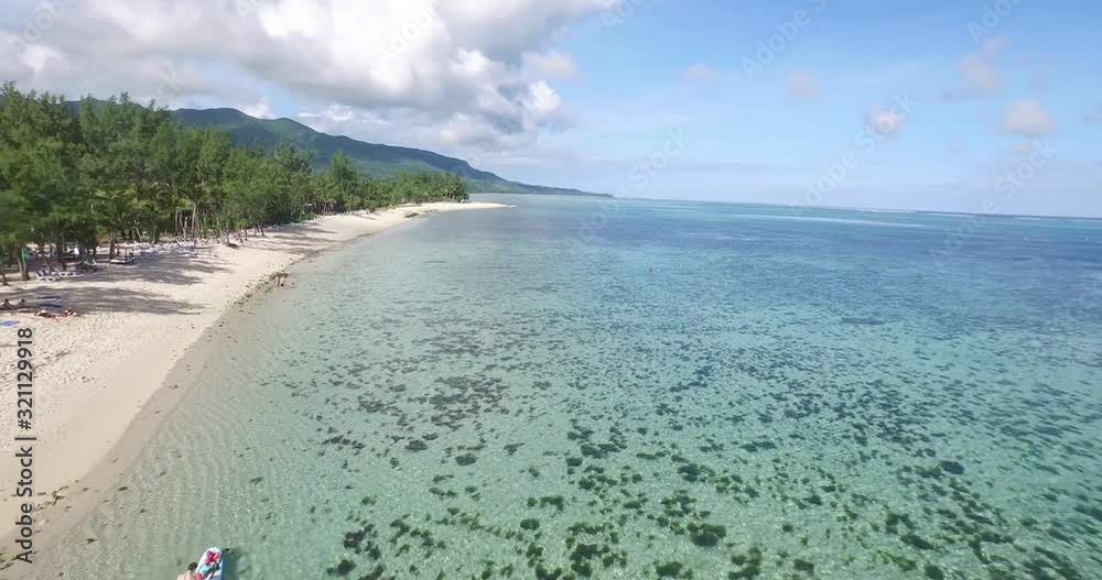 Tracking shot of ocean and mountain on sunny day, Mauritius Tracking shot of ocean and mountain on sunny day, Mauritius