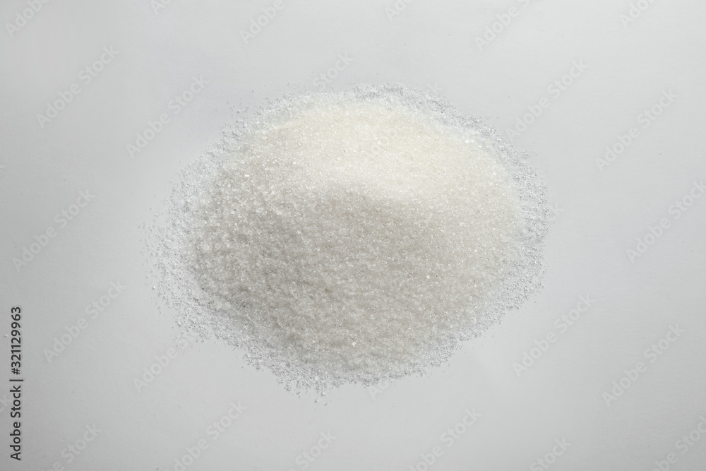 Pile of granulated sugar isolated on white