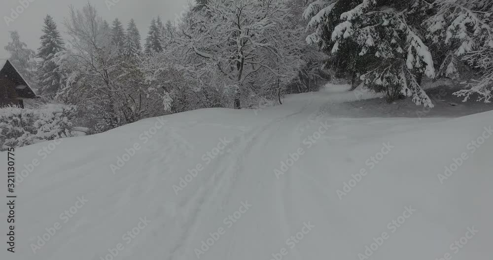 Tracking shot of skis moving across snowcapped landscape, Laax, Switzerland Tracking shot of skis moving across snowcapped landscape, Laax, Switzerland