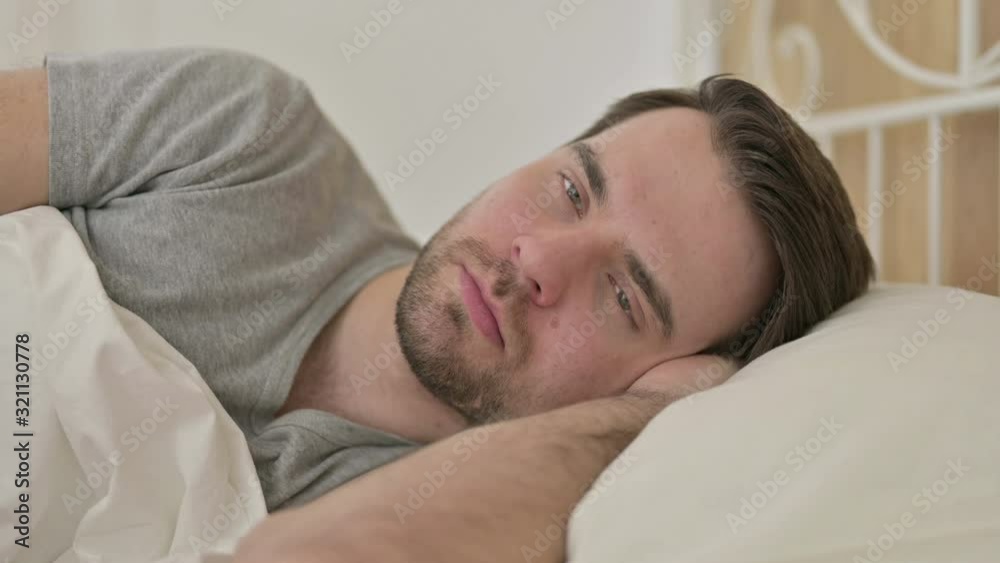 Portrait of Beard Young Man Thinking in Bed Portrait of Beard Young Man Thinking in Bed