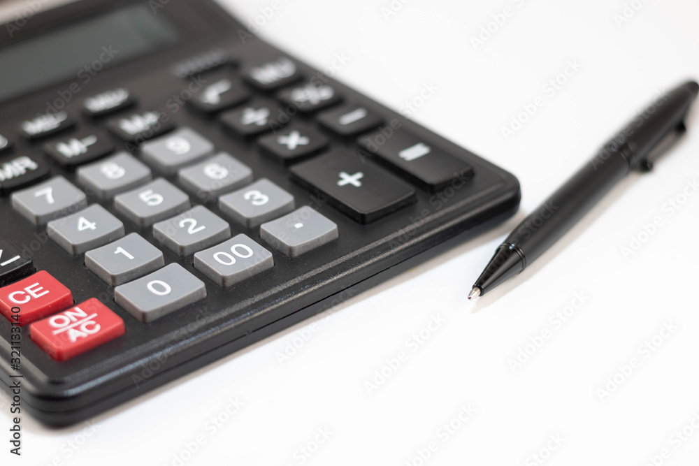 Calculator and pen isolated on white background Calculator and pen isolated on white background