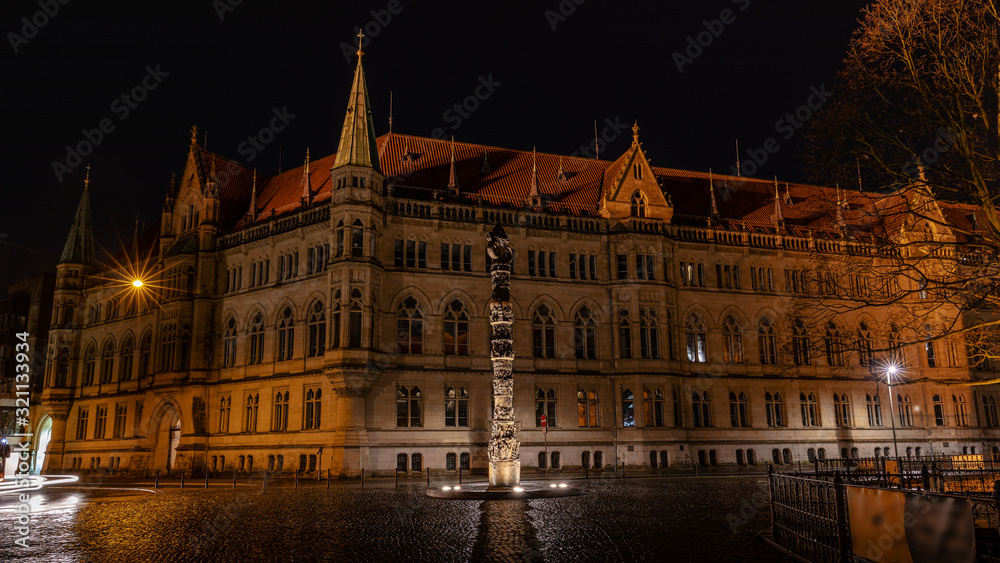Historical building illuminated in Braunschweig winter night