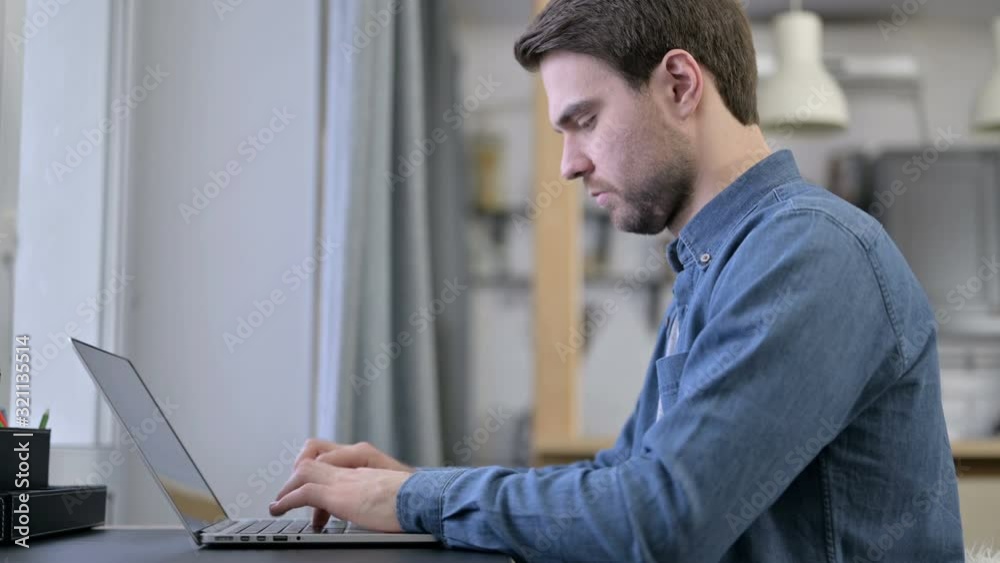 Ambitious Beard Young Man working on Laptop Ambitious Beard Young Man working on Laptop