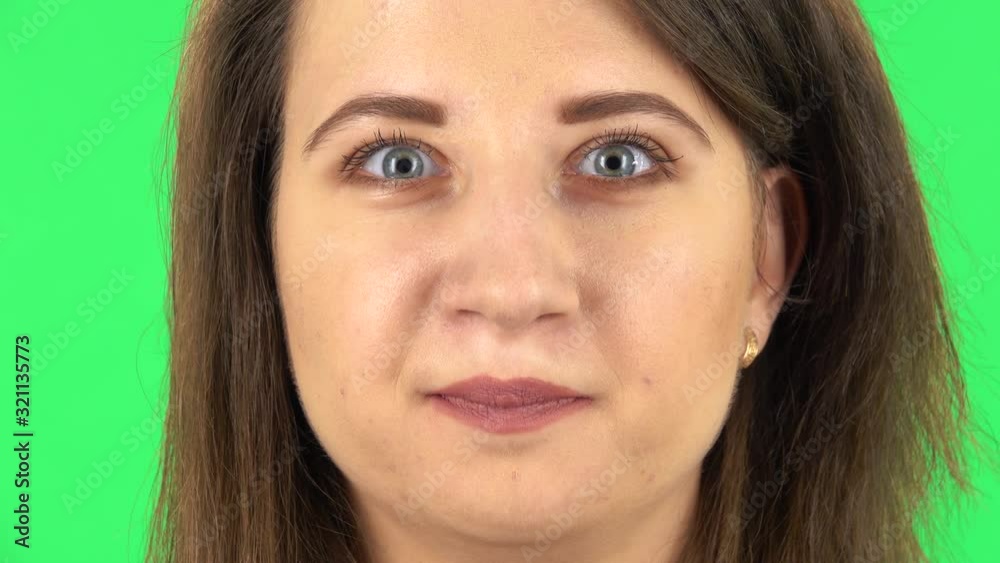 Girl is looking looking at the camera with worry. Close up. Green screen