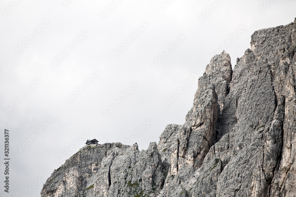 Hiking Dolomites mountains of Passo Giau. Peaks in South Tyrol in the Alps of Europe. Alpine Cabin Hiking Dolomites mountains of Passo Giau. Peaks in South Tyrol in the Alps of Europe. Alpine Cabin