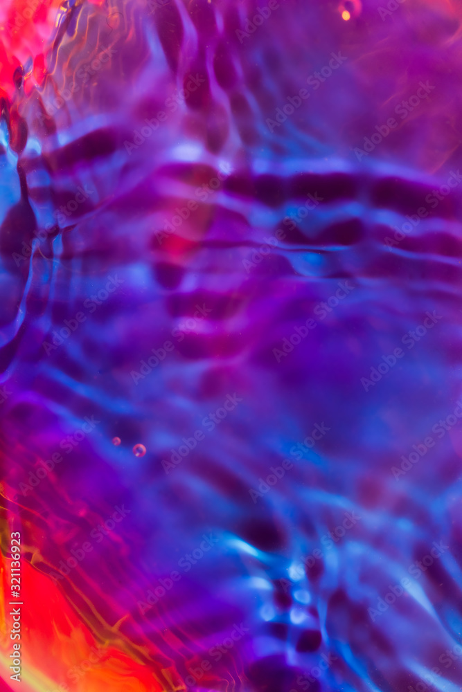 Purple iridescent water ripple conceptual photo Purple iridescent water ripple conceptual photo