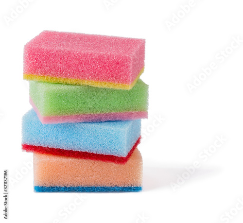 Four multicolored kitchen foam sponges of pastel colors isolated on white background. Sponge for washing dishes and housework.