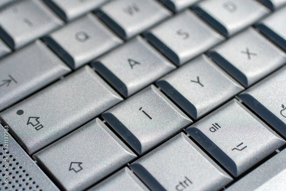 Silver keyboard on an old laptop Silver keyboard on an old laptop
