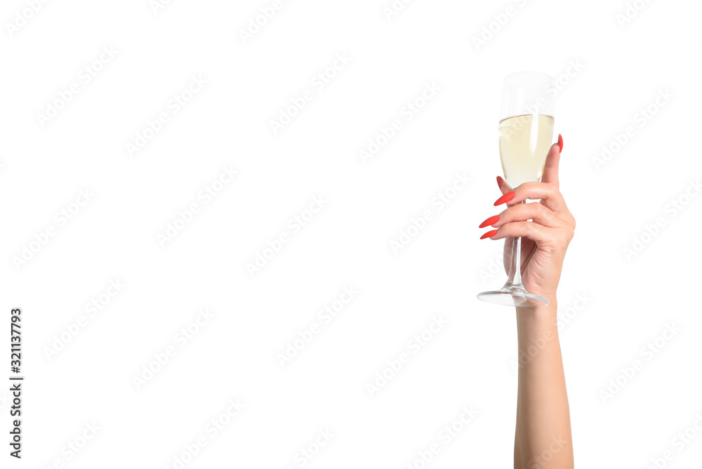 Young female hand with a glass of champagne on a white background, with text space. Young female hand with a glass of champagne on a white background, with text space.