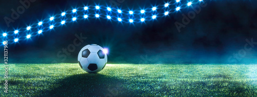 Football panorama banner with spotlights and ball