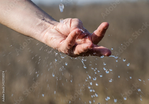 Water flows into the hands of a man. Hands cleaning © bogdan vacarciuc
