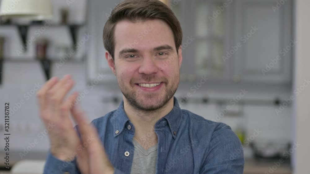 Portrait of Beard Young Man Smiling and Clapping