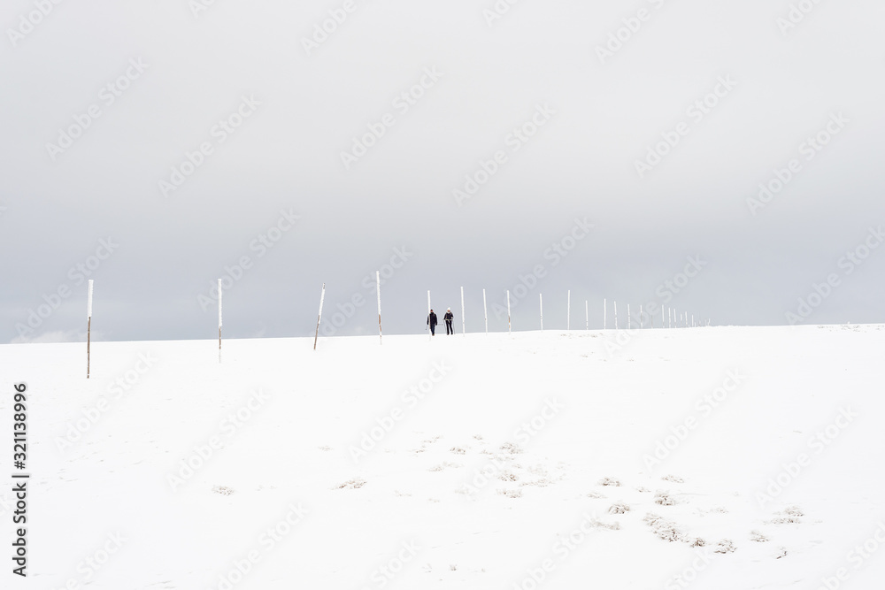 People silhouettes walking snow plain mountain top winter snow in winter People silhouettes walking snow plain mountain top winter snow in winter