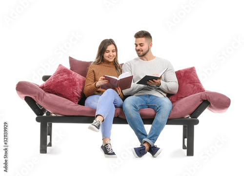 Young couple reading books ...