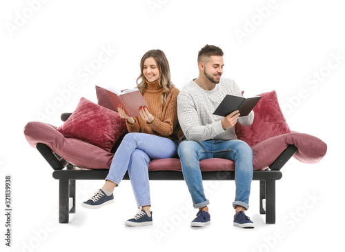 Young couple reading books ...