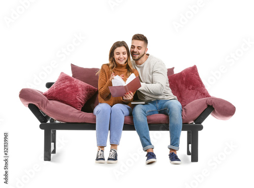 Young couple reading book w...