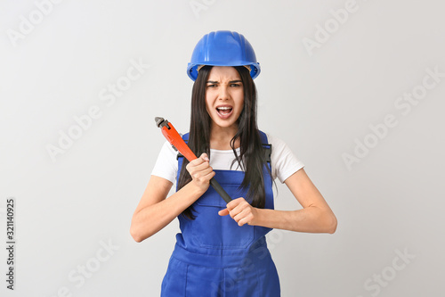 Female worker against light...